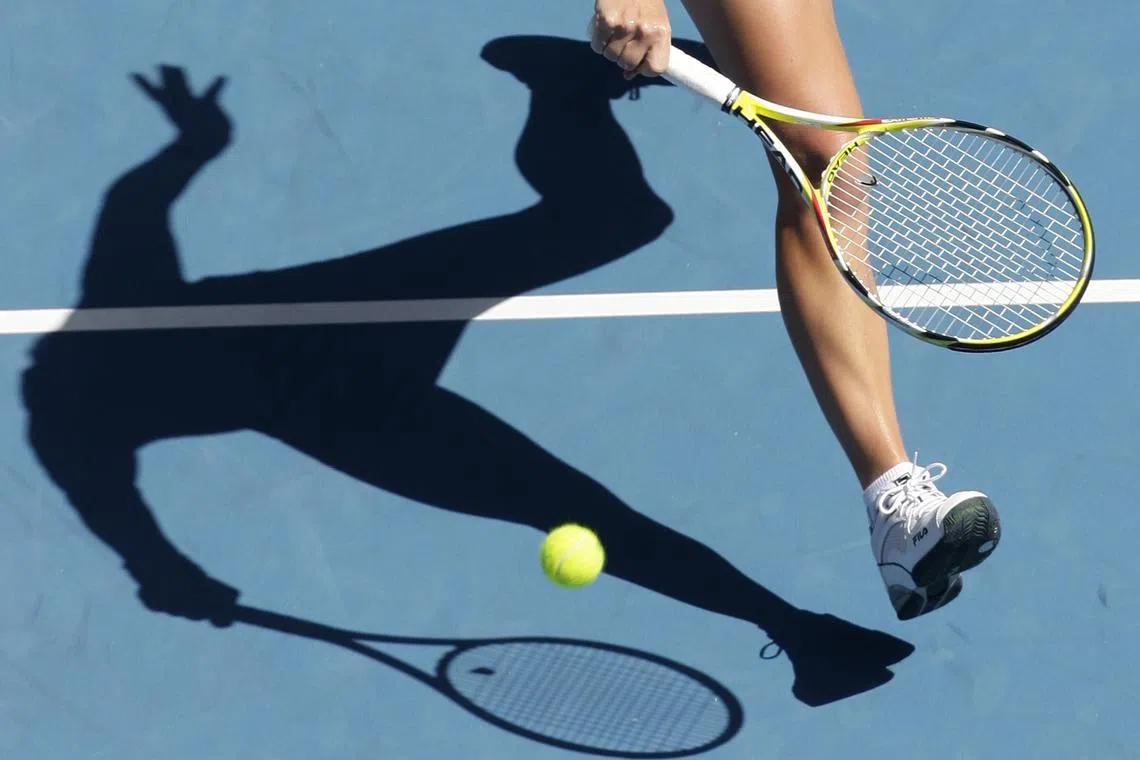 FILE PHOTO: The shadow of a tennis player is seen during a match. REUTERS/Daniel Munoz/ File Photo