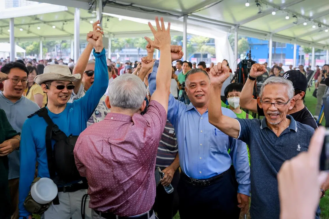 Supporters of Tan Kin Lian cheering at the nomination centre.