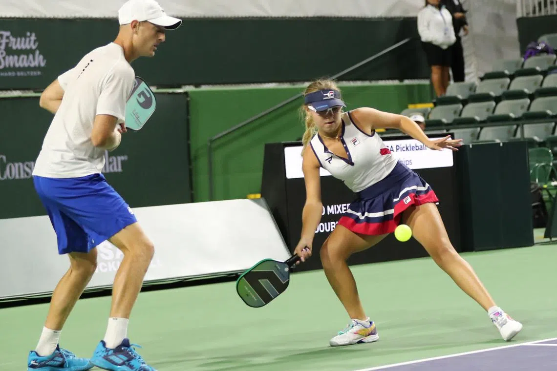 Anna Leigh Waters hits a forehand shot against Ben Johns and Catherine Parenteau in the 2022 Margaritaville USA Pickleball Nationals Championships at Indian Wells on Nov 13, 2022.