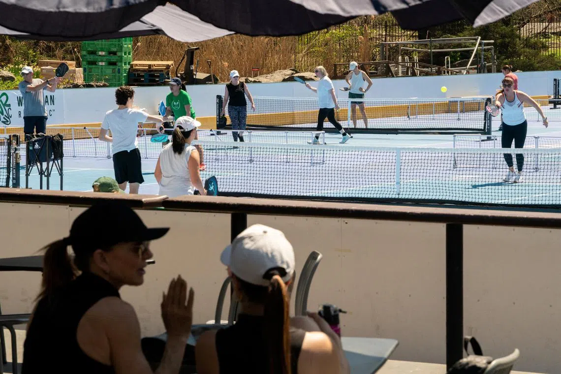 FILE PHOTO: People play pickle ball at Central Park's Wollman Rink in New York City, U.S., April 12, 2023. REUTERS/David Dee Delgado/File Photo
