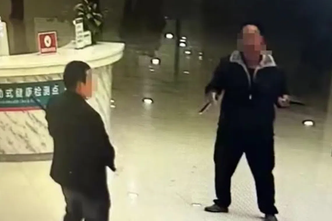 Images published by state-run news site The Paper appeared to show a man pointing a knife at another man who is wielding a stick in a hospital lobby.