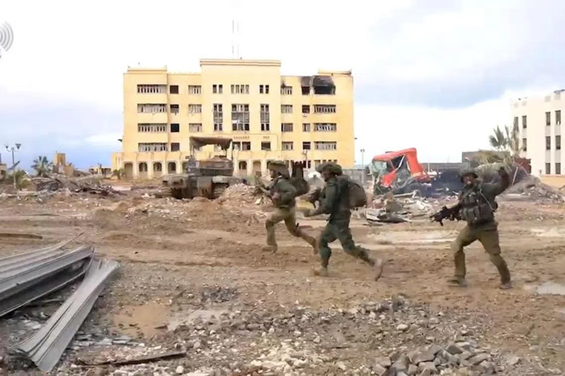 Israeli soldiers operate in the Gaza Strip amid the ongoing conflict between Israel and the Palestinian Islamist group Hamas, in this screen grab taken from a handout video released on January 31, 2024. Israel Defense Forces/Handout via REUTERS