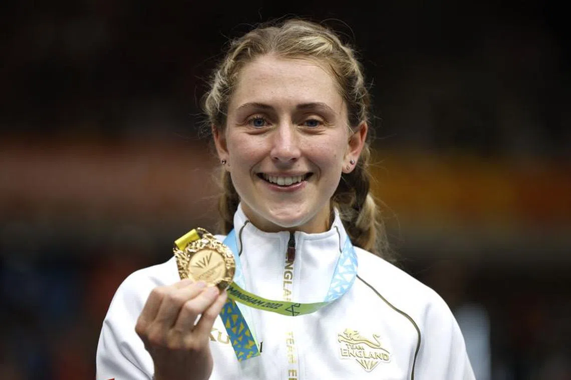 Commonwealth Games - Cycling - Women's 10km Scratch Race - Medal Ceremony - Lee Valley VeloPark, London, Britain - August 1, 2022 Gold medallist England's Laura Kenny celebrates on the podium after winning the women's 10km scratch race REUTERS/John Sibley/ File photo