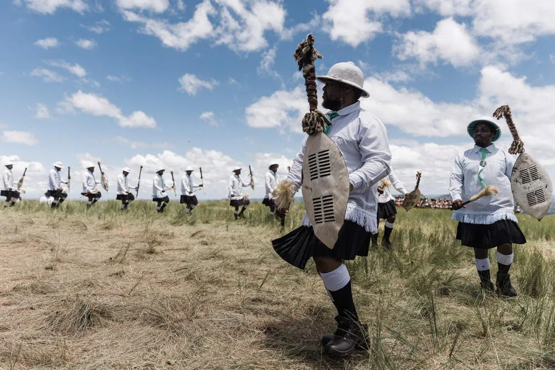 Followers of the Nazareth Baptist Church, from the Ekuphakameni group, also known as the Shembe Church, dressed in traditional attire, take part in a cultural dance on the Nhlangakazi Holy Mountain in Ndwedwe 85km north of Durban, on Jan 8, 2023. 