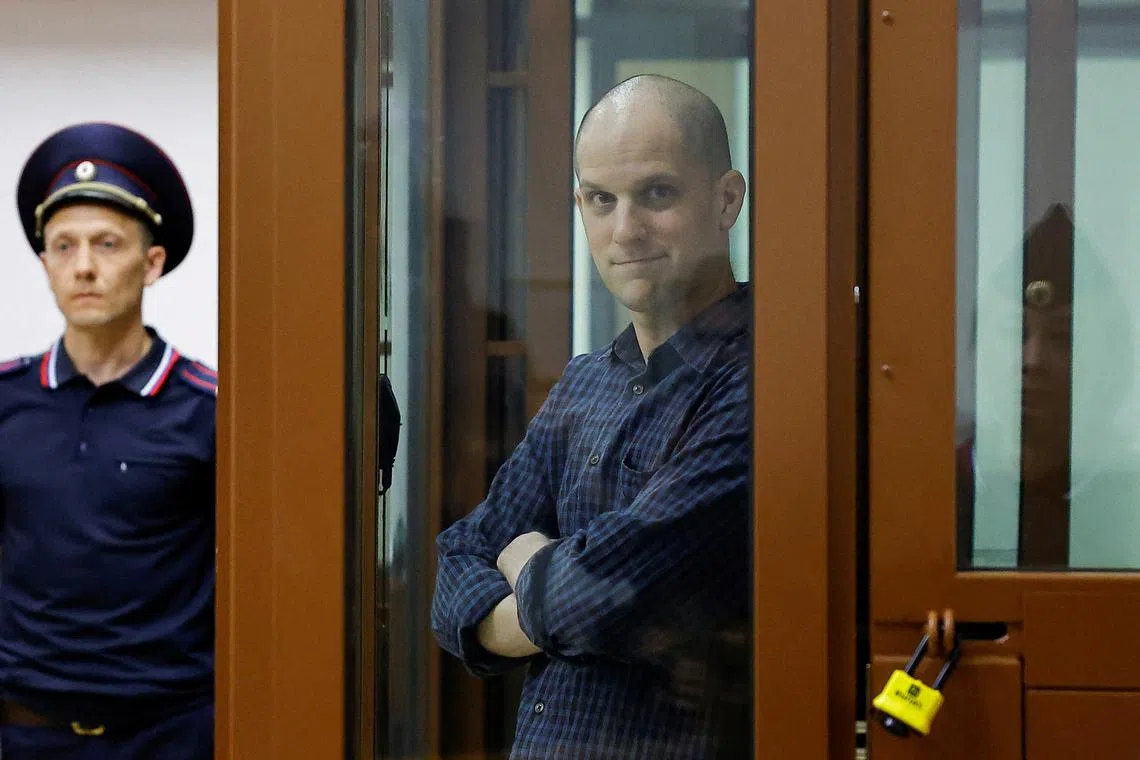 FILE PHOTO: Wall Street Journal reporter Evan Gershkovich, who stands trial on spying charges, is seen inside an enclosure for defendants before a court hearing in Yekaterinburg, Russia June 26, 2024. REUTERS/Evgenia Novozhenina/File Photo