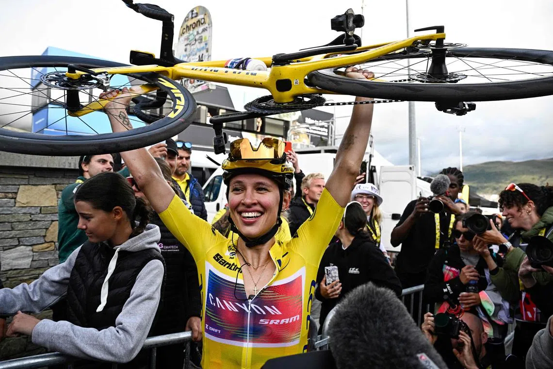 Canyon//SRAM Racing team's Polish rider Katarzyna Niewiadoma celebrating after winning the 8th and last stage of the Women's Tour de France.