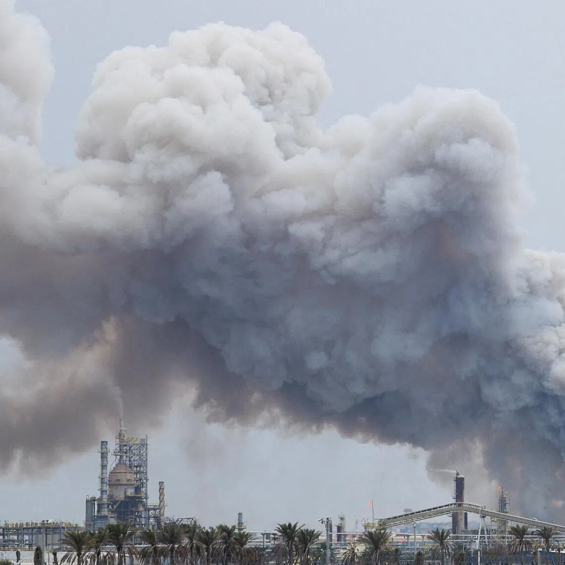 Smoke rises following a strike on the Bapco Oil Refinery in  Bahrain on March 9.