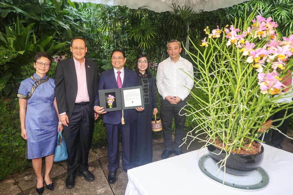 Dr Tan See Leng (second from left) and spouse (left), with Vietnam Prime Minister Pham Minh Chinh (centre) and spouse at an Orchid Naming Ceremony, on Feb 9, 2023. 