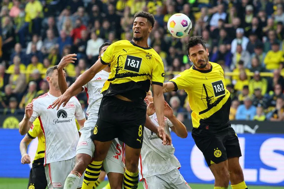 FILE PHOTO:Soccer Football - Bundesliga - Borussia Dortmund v Union Berlin - Signal Iduna Park, Dortmund, Germany - October 7, 2023 Borussia Dortmund's Felix Nmecha and Mats Hummels in action REUTERS/Wolfgang Rattay/File Photo