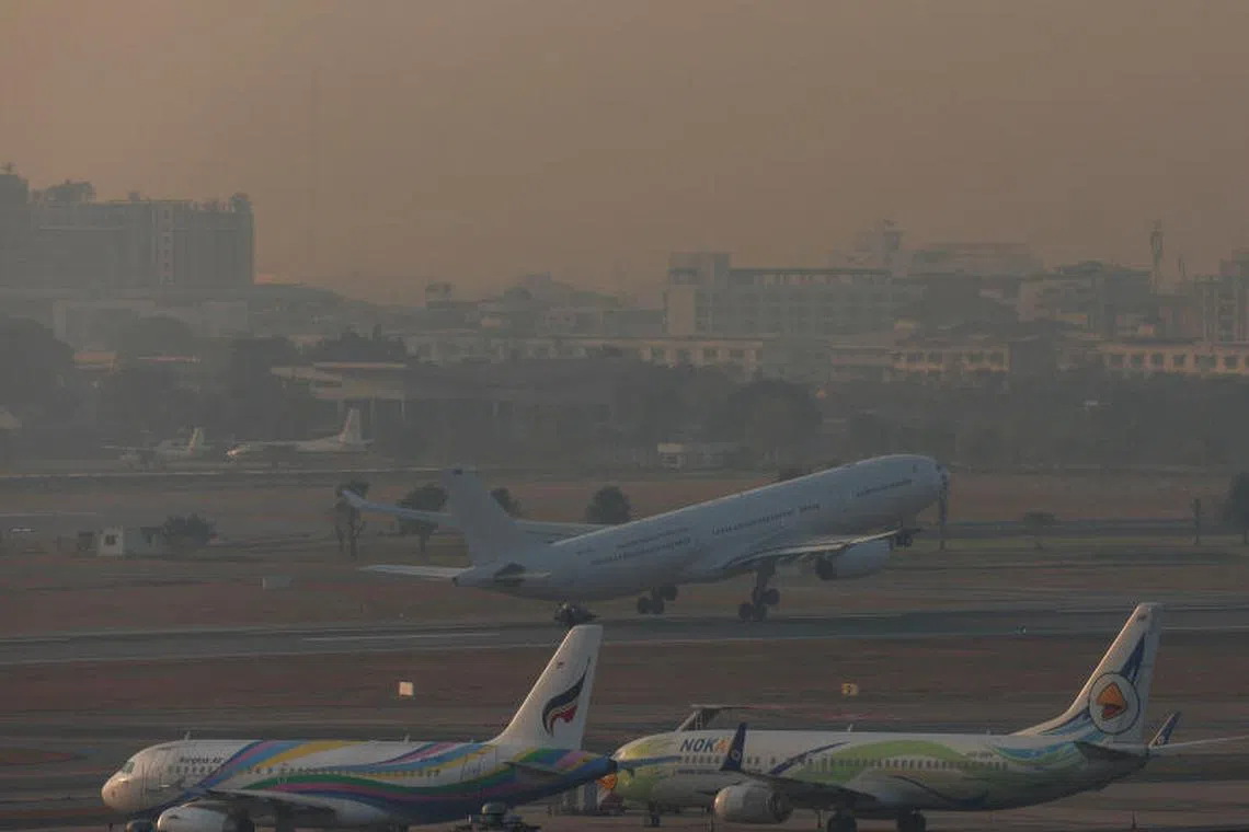 A view shows planes amid air pollution, in Bangkok, Thailand, January 31, 2025. REUTERS/Chalinee Thirasupa
