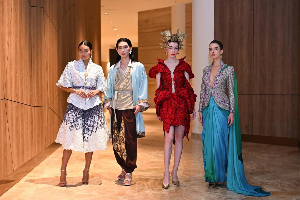 ST20231012-202371572987-Lim Yaohui-Louisa Lim Ee Lynn-llkebaya/
(From left) Models Melanie Jane Fernandez, Opera Tang, Magdalena Szymanek and Luca Marie Scholz during Singapore Fashion Council Gala 2023 at Pan Pacific Hotel Singapore on Oct 12, 2023.
The Singapore Stories 2023 theme, “Kebaya, Re-imagined”, commemorates the re-opening of the Peranakan Museum and National Heritage Board’s multinational nomination to inscribe “Kebaya: Knowledge, Skills, Traditions and Practices” on the UNESCO Representative List of Intangible Cultural Heritage (ICH) of Humanity at the end of March 2023.
Kebaya Re-Imagined lets designers engage and explore this iconic regional garment – envisioning the future of the kebaya and its place through innovative or sustainable fashion. It will present a jubilant display featuring more than 30 accomplished Singaporean fashion designers, united by a multicultural fashion runway extravaganza.
(ST PHOTO: LIM YAOHUI)