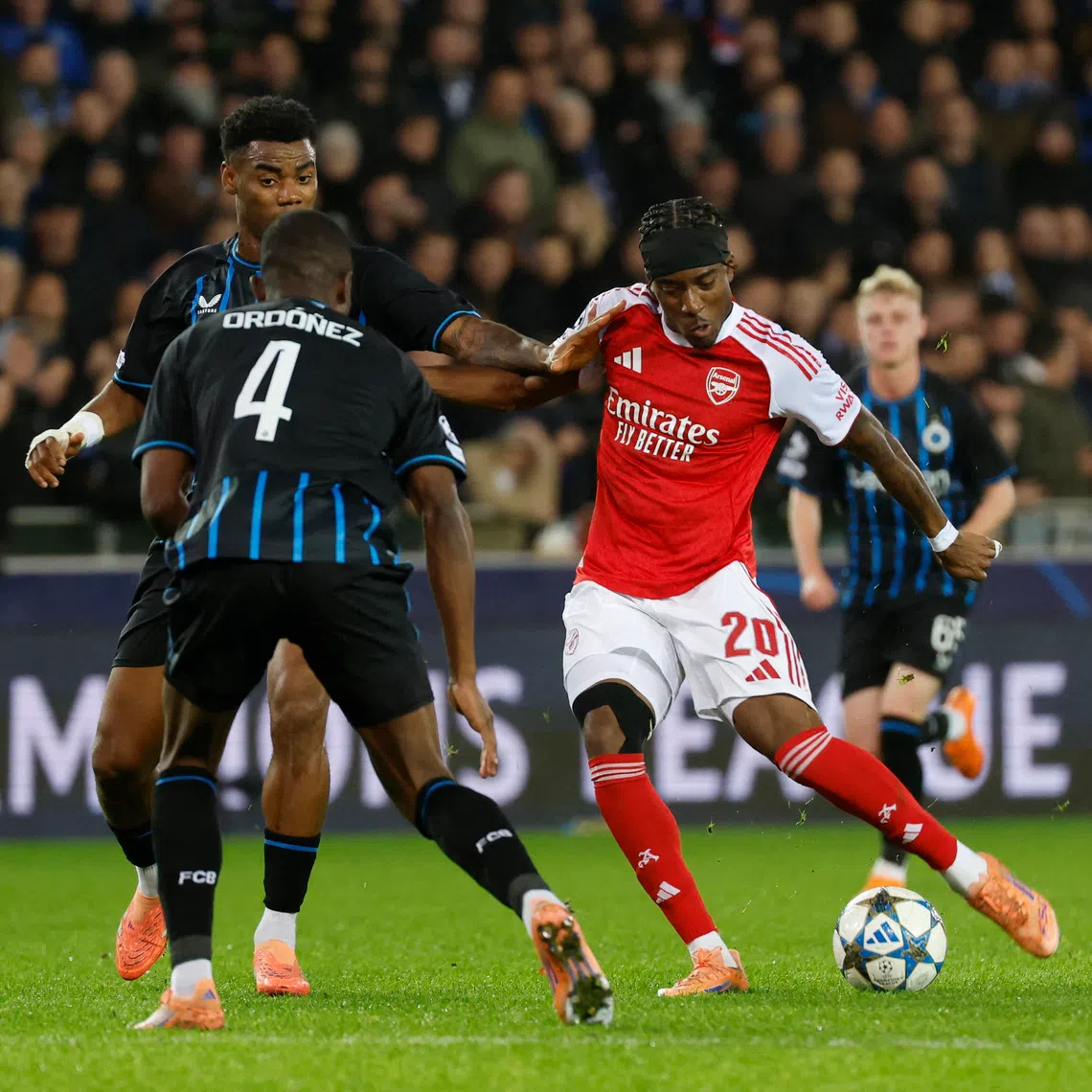 Soccer Football - UEFA Champions League - Club Brugge v Arsenal - Jan Breydel Stadium, Bruges, Belgium - December 10, 2025 Arsenal's Noni Madueke scores their first goal REUTERS/Geert Vanden Wijngaert