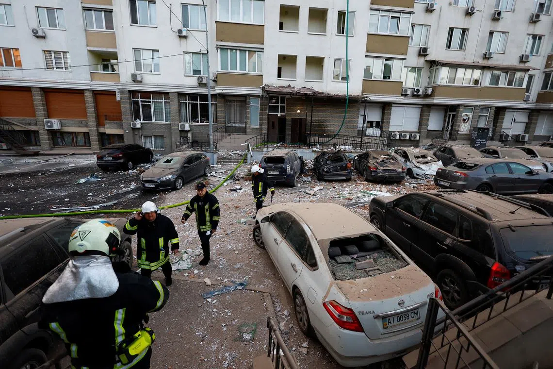 Cars that were damaged during a massive Russian drone strike in Kyiv, Ukraine, on May 30, 2023. 