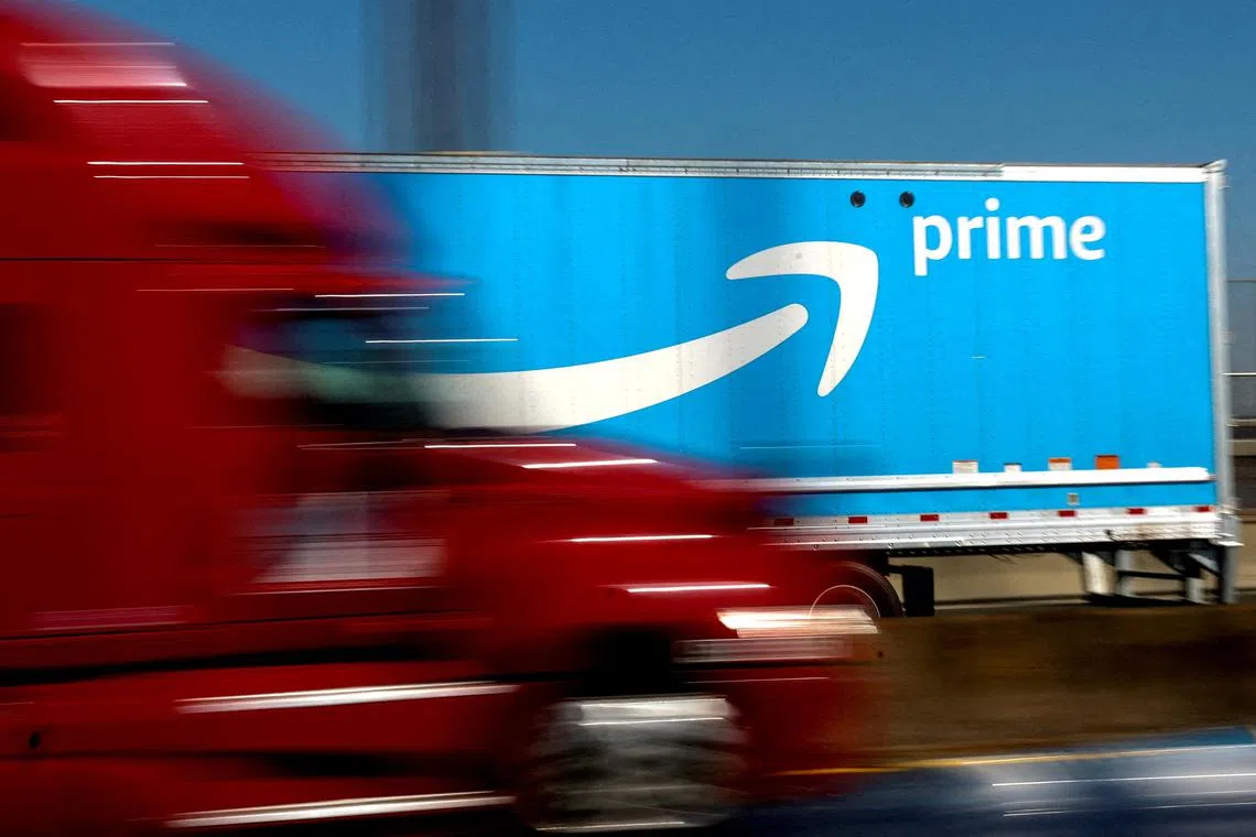 FILE PHOTO: An Amazon Prime truck is pictured as it crosses the George Washington Bridge on Interstate Route 95 during Amazon's two-day "Prime Early Access Sale" shopping event for Amazon members in New York City, New York, U.S., October 11, 2022. REUTERS/Mike Segar/File Photo