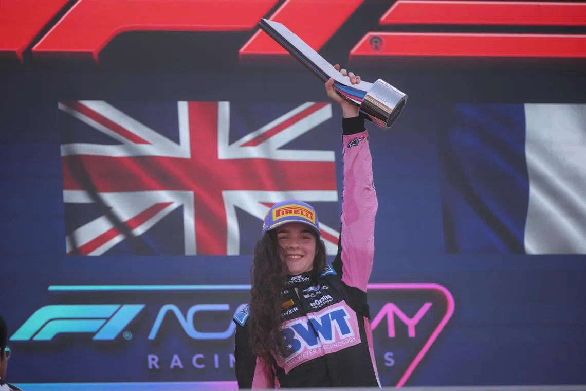 [NOTE: F1 photos are for editorial use only and NOT for sale.] Alpine’s Abbi Pulling celebrates after winning the F1 Academy second race at the  Marina Bay street circuit on September 22, 2024.  