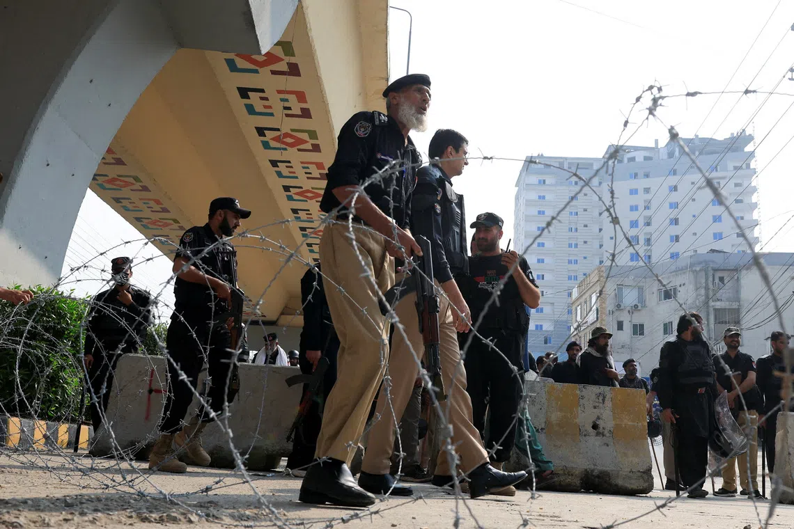 Police guard a road leading to Red Zone, in Peshawar, Khyber Pakhtunkhwa province, Pakistan, Oct 11, 2026.