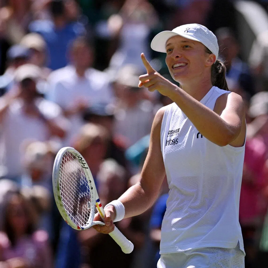 Tennis - Wimbledon - All England Lawn Tennis and Croquet Club, London, Britain - July 2, 2026
Poland's Iga Swiatek celebrates after winning her second round match against Czech Republic's Karolina Pliskova REUTERS/Jaimi Joy     TPX IMAGES OF THE DAY