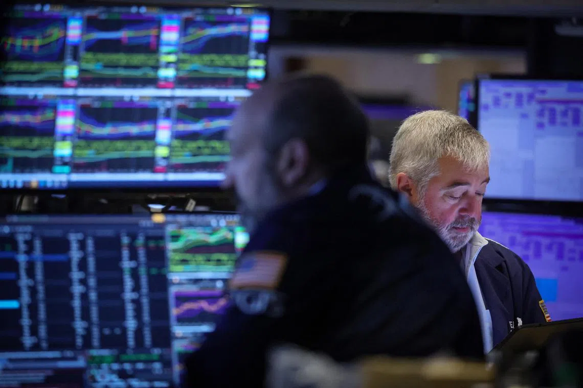 Traders work on the floor of the New York Stock Exchange.