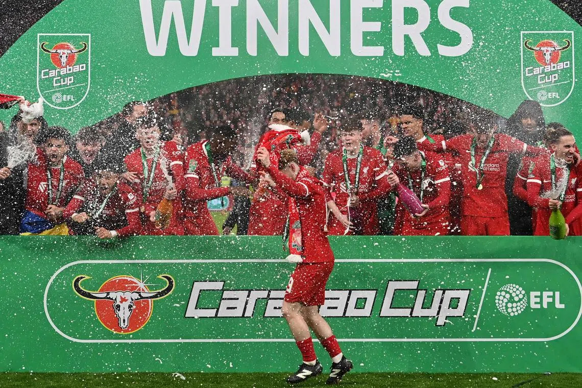 Liverpool celebrating their Carabao League Cup victory, defeating Chelsea 1-0 on Feb 25, 2024