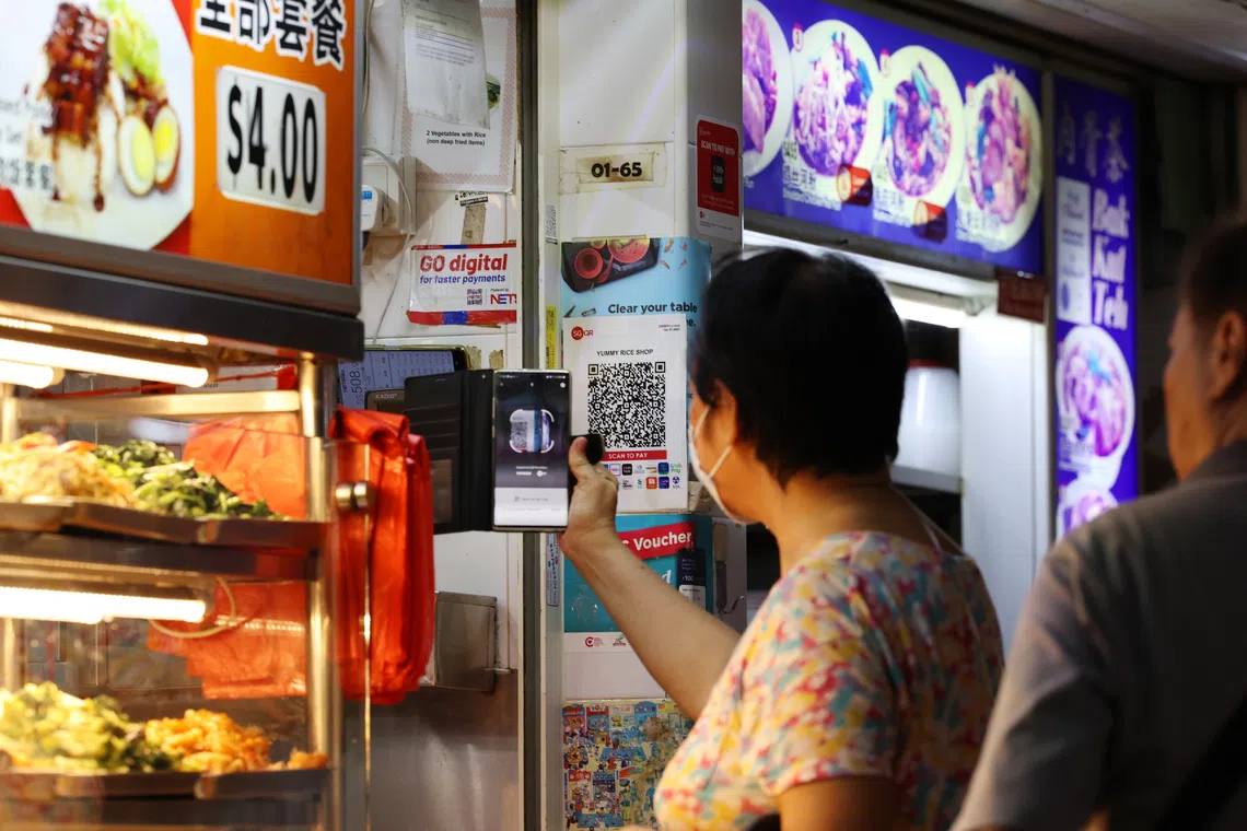 The writer says that the average Singaporean consumer faces multiple cashless payment choices, but not always true convenience.