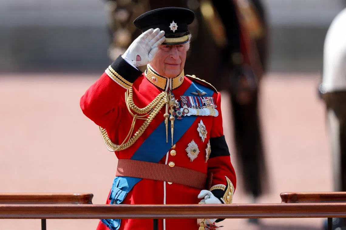 King Charles honours air crash victims at military parade