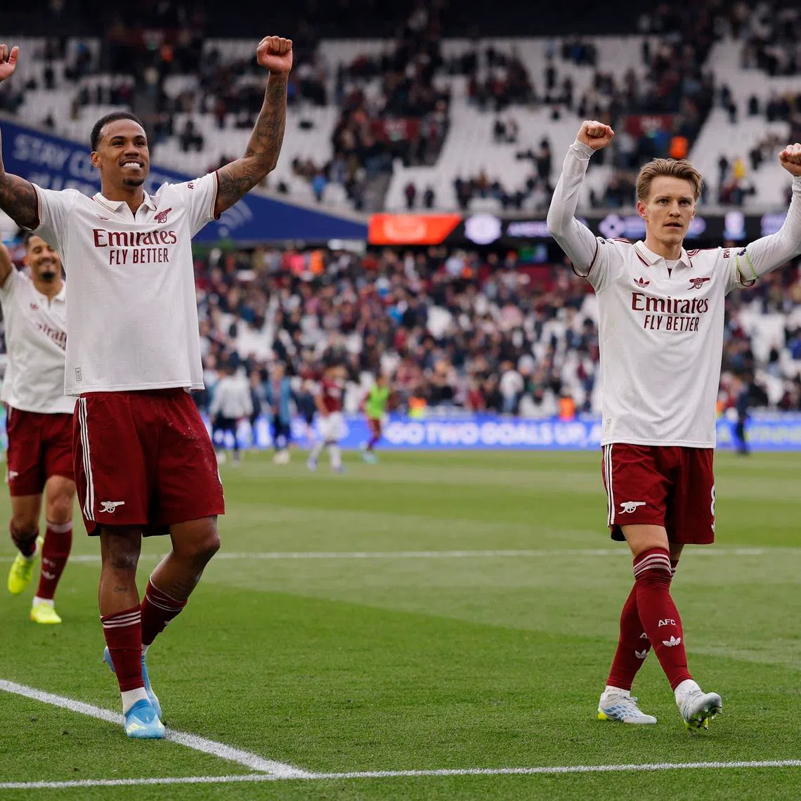 Soccer Football - Premier League - West Ham United v Arsenal - London Stadium, London, Britain - May 10, 2026 Arsenal's Gabriel Magalhaes and Martin Odegaard celebrate after the match Action Images via Reuters/Andrew Couldridge/File Photo