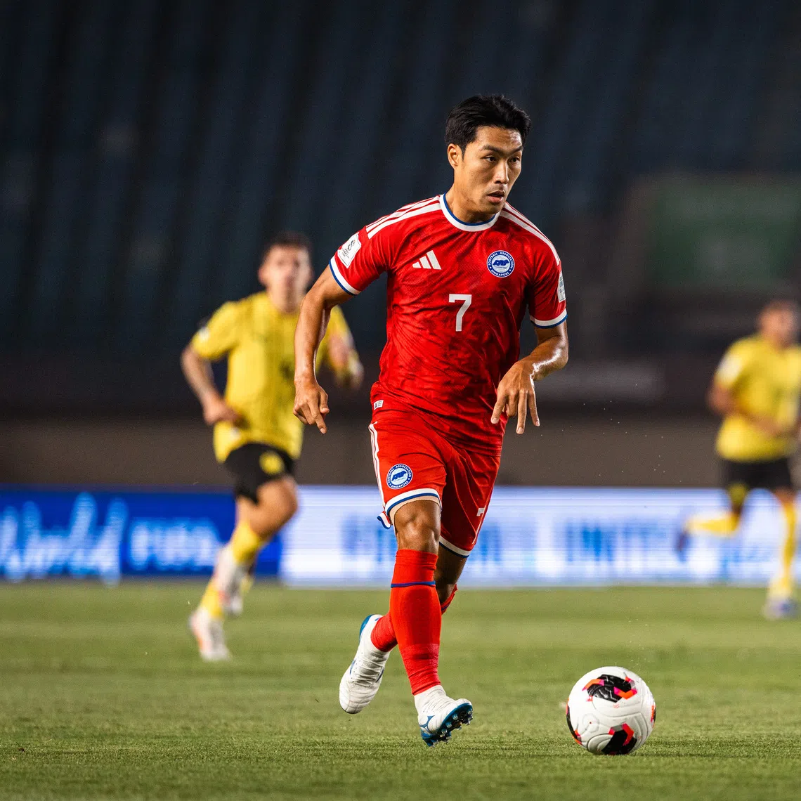 Lions’ South Korean-born midfielder Song Ui-young dribbling with the ball in the FIFA ASEAN Cup match against Malaysia on Oct 1. Singapore lost 6-0.