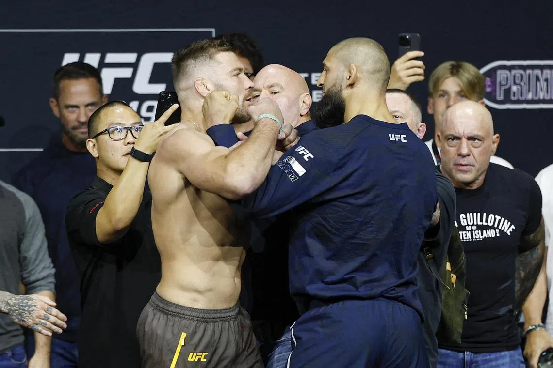 Dricus du Plessis (left) and Khamzat Chimaev during weigh-ins for UFC 319 at Radius Chicago on Aug 15, 2025.