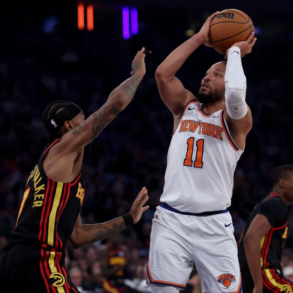 Jalen Brunson of the New York Knicks takes a shot as Nickeil Alexander-Walker of the Atlanta Hawks defends during the first half of Game One.