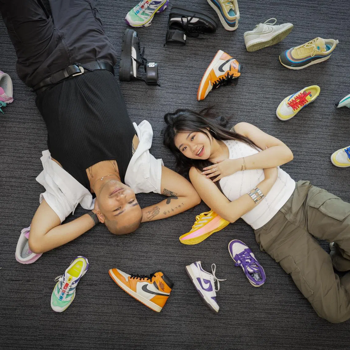 (From left): Profile of Joshua Simon and Shawnia Seah, both deejays from Kiss92, with part of their sneaker collections photographed at News Centre on Nov 29, 2024. 

They also hold iPads to show them designing their own sneakers as part of the Sneaker Con SEA and SPH Media Design Your Sneaker competition, for young people aged 16 to 25. The contest is to be launched in December, and the top designer can win $3,000 cash and limited-edition sneakers (or equivalent).
