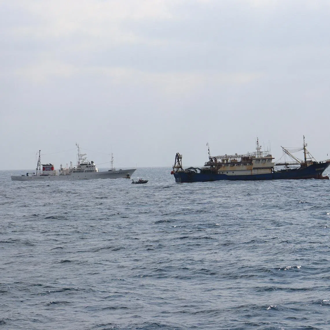Japan's Fisheries Agency patrol vessel \"Hakuo Maru\" and Chinese fishing vessel \"Qiong Dong Yu 11998\" in waters off southwest Nagasaki Prefecture, Japan, February 12, 2026, in this handout photo provided by the Fisheries Agency of Japan. Fisheries Agency of Japan/Handout via REUTERS