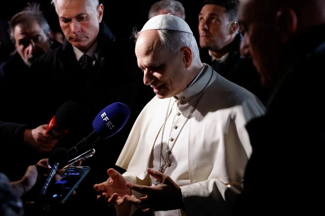 Pope Leo XIV speaks to the media as he leaves the papal residence to head back to the Vatican, in Castel Gandolfo, Italy, March 31, 2026. REUTERS/Remo Casilli