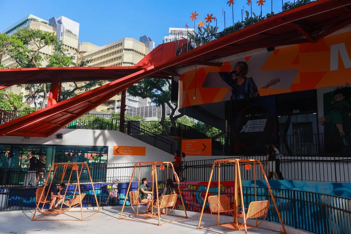 Some youth prefer to hang out on the swings outside *Scape.