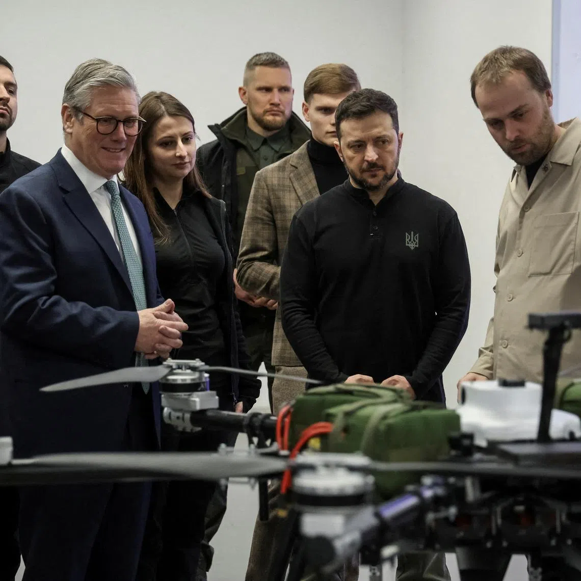 FILE PHOTO: British Prime Minister Keir Starmer and Ukraine's President Volodymyr Zelenskiy attend a presentation of Ukrainian military drones, amid Russia's attack on Ukraine, at an undisclosed location in Ukraine January 16, 2025.REUTERS/Oleksandr Ratushniak/File Photo