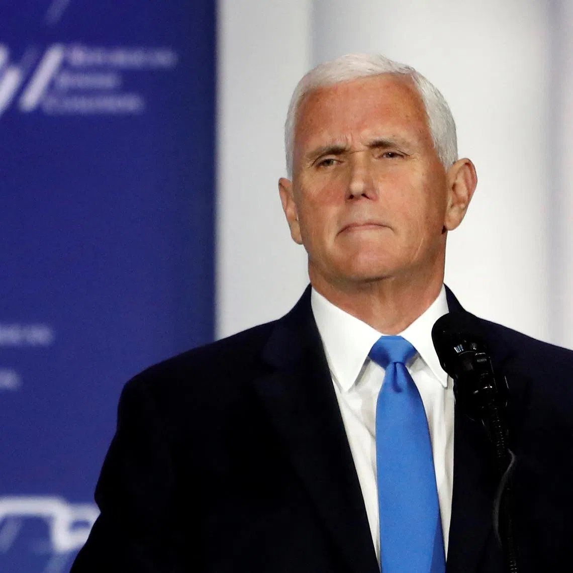 FILE PHOTO: Former U.S. Vice President Mike Pence stands at the podium after announcing he will discontinue his presidential campaign, during the Republican Jewish Coalition Annual Leadership Summit in Las Vegas, Nevada, U.S. October 28, 2023. REUTERS/Steve Marcus/File Photo