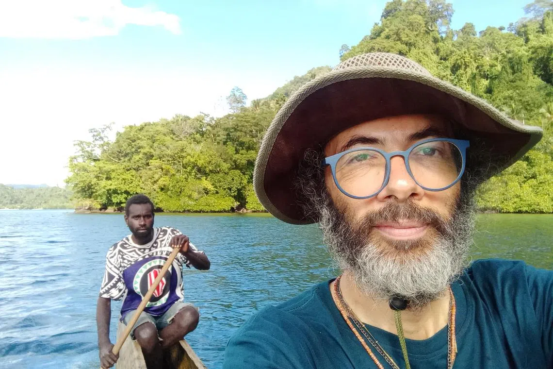 A photo provided by Gianluca Grimalda shows Grimalda, an Italian social scientist, on his way to Pokpok Island in Papua New Guinea, where he was conducting field research, by canoe. To reduce emissions, Grimalda took five trains, nine buses, two ferries, two taxis, one shared car and one police convoy to reach the research site in the South Pacific, but he said his plan to return to Kiel, Germany, much the same way cost him his job. (Gianluca Grimalda via The New York Times) -- NO SALES; FOR EDITORIAL USE ONLY WITH NYT STORY SLUGGED CLIMATE RESEARCHER FIRED BY CARA BUCKLEY FOR OCT. 13, 2023. ALL OTHER USE PROHIBITED. --
