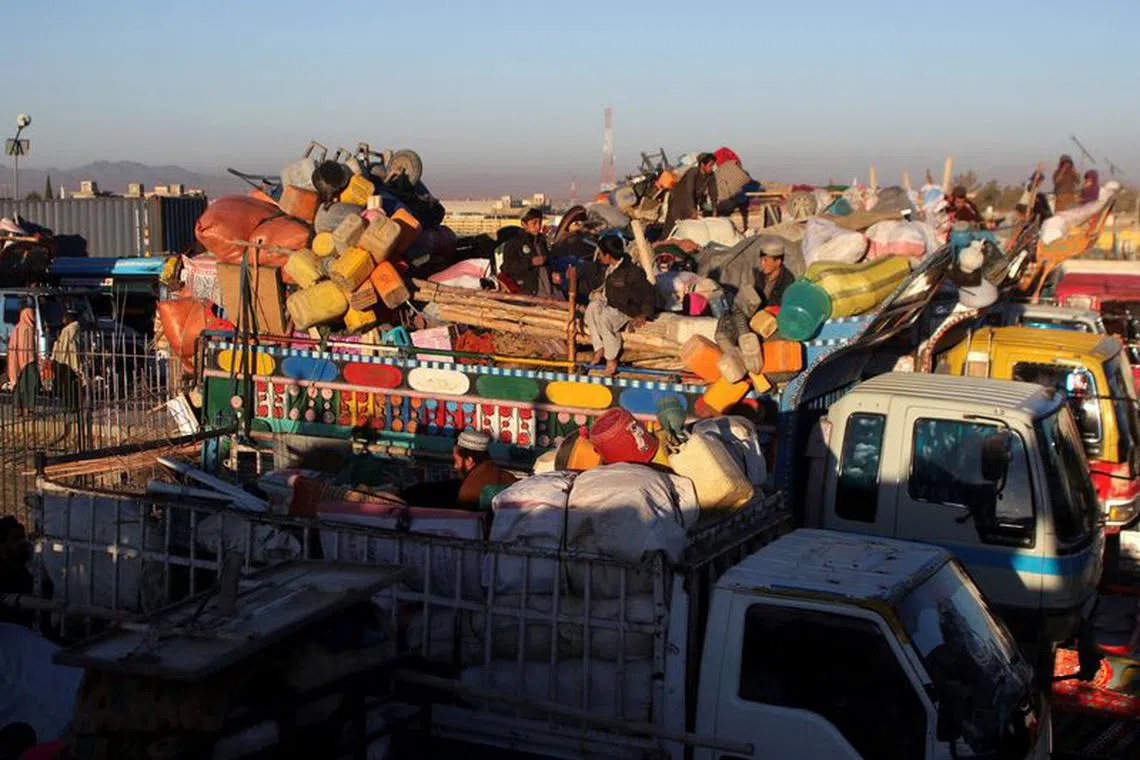 Afghan nationals with belongings sit atop a truck as they head back with their families to Afghanistan from Pakistan, at the Chaman Border Crossing along the Pakistan-Afghanistan Border in Balochistan Province, in Chaman, Pakistan November 10, 2023. REUTERS/Naseer Ahmed/File Photo