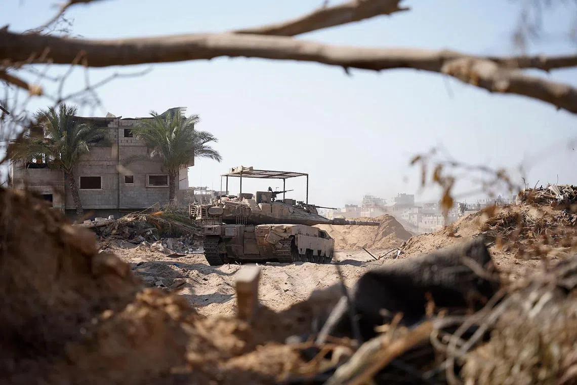 This handout picture released by the Israeli army shows an Israeli tank on the ground in the Gaza Strip on June 17, 2024, amid the ongoing conflict between Israel and the Palestinian militant group Hamas. (Photo by Israeli Army / AFP) / === RESTRICTED TO EDITORIAL USE - MANDATORY CREDIT "AFP PHOTO / Handout / Israeli Army' - NO MARKETING NO ADVERTISING CAMPAIGNS - DISTRIBUTED AS A SERVICE TO CLIENTS ==