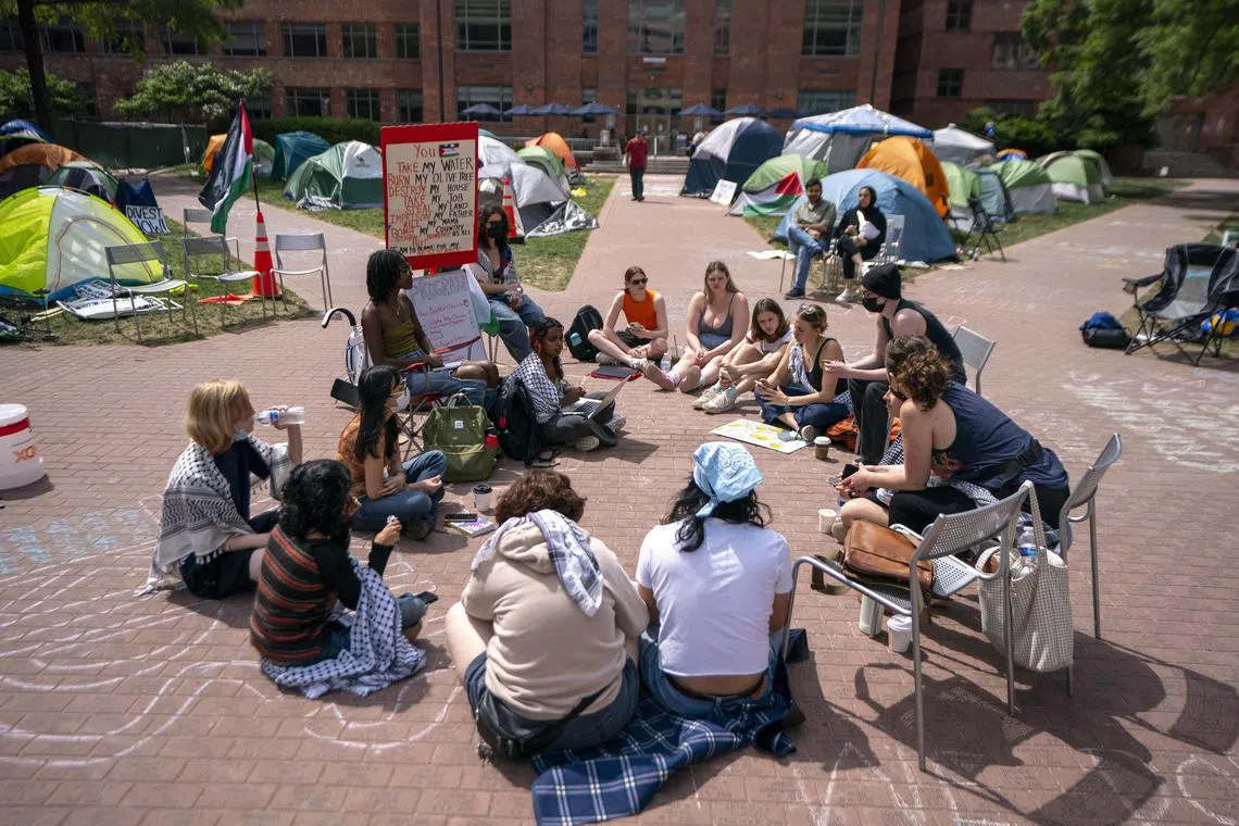 Activists at a George Washington University pro-Palestinian encampment participate in a political education session, on May 3, 2024. 