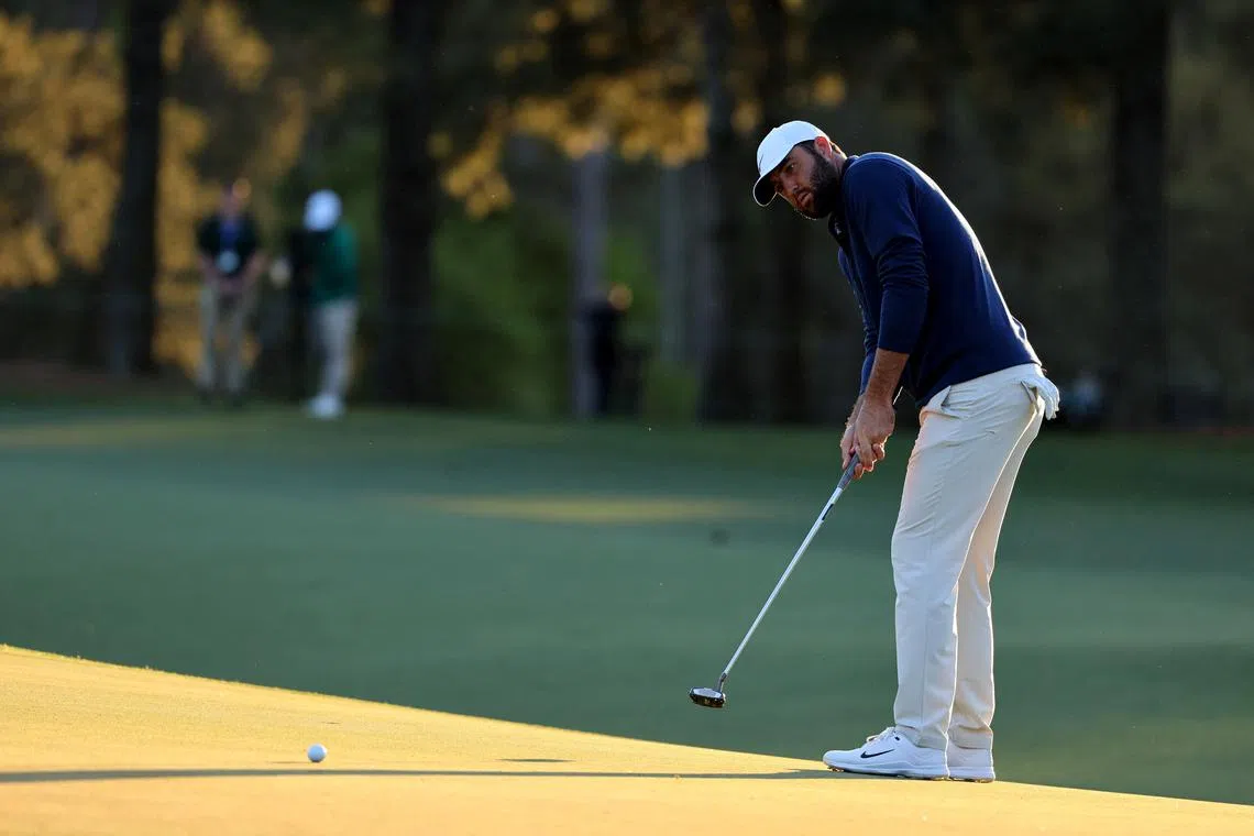 Golf - The Masters - Augusta National Golf Club, Augusta, Georgia, U.S. - April 12, 2024 Scottie Scheffler of the U.S. hits his putt on the 17th hole during the second round REUTERS/Mike Blake/File Photo