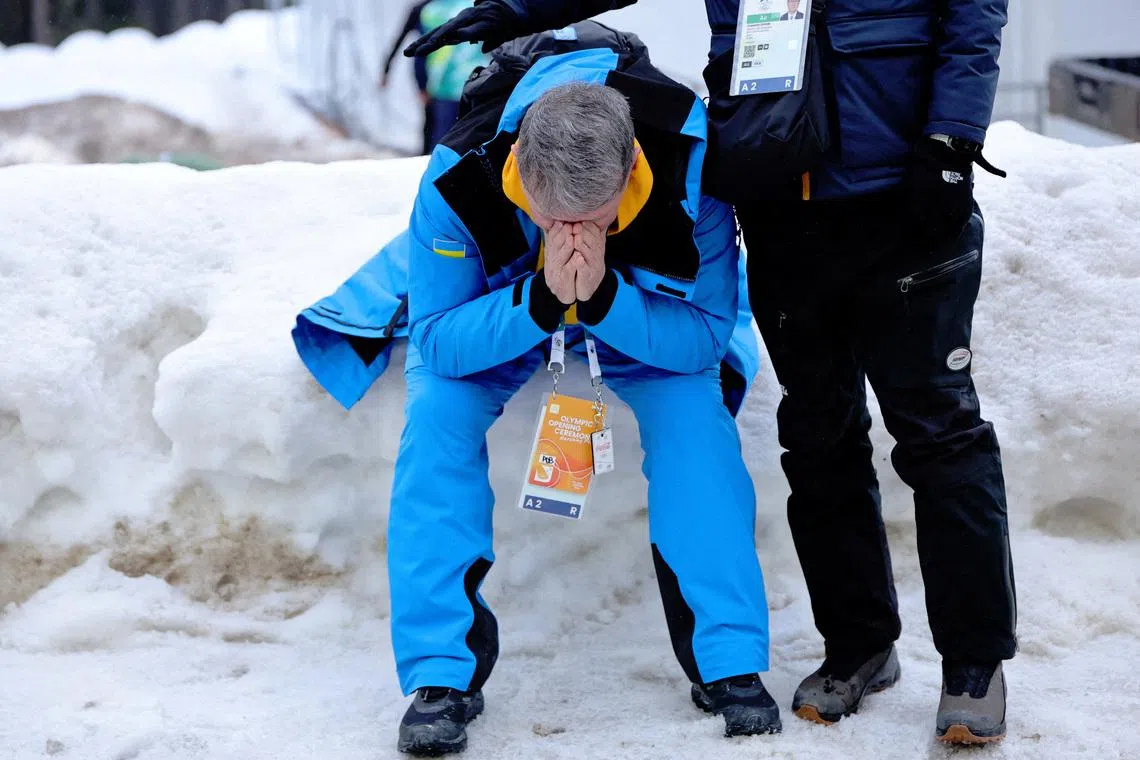 Mykhailo Heraskevych, father and coach of Vladyslav Heraskevych of Ukraine reacts after he gets disqualified for wearing a helmet in tribute to athletes who have died amid Russia's attack on Ukraine after a scheduled meeting with IOC President Kirsty Coventry REUTERS/Athit Perawongmetha