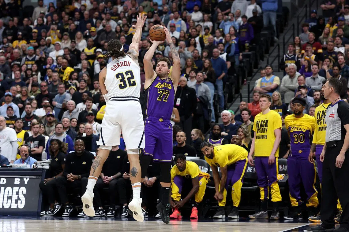 Luka Doncic of the Los Angels Lakers puts up a shot against Aaron Gordon of the Denver Nuggets in the first quarter at Ball Arena on Feb 22, 2025.