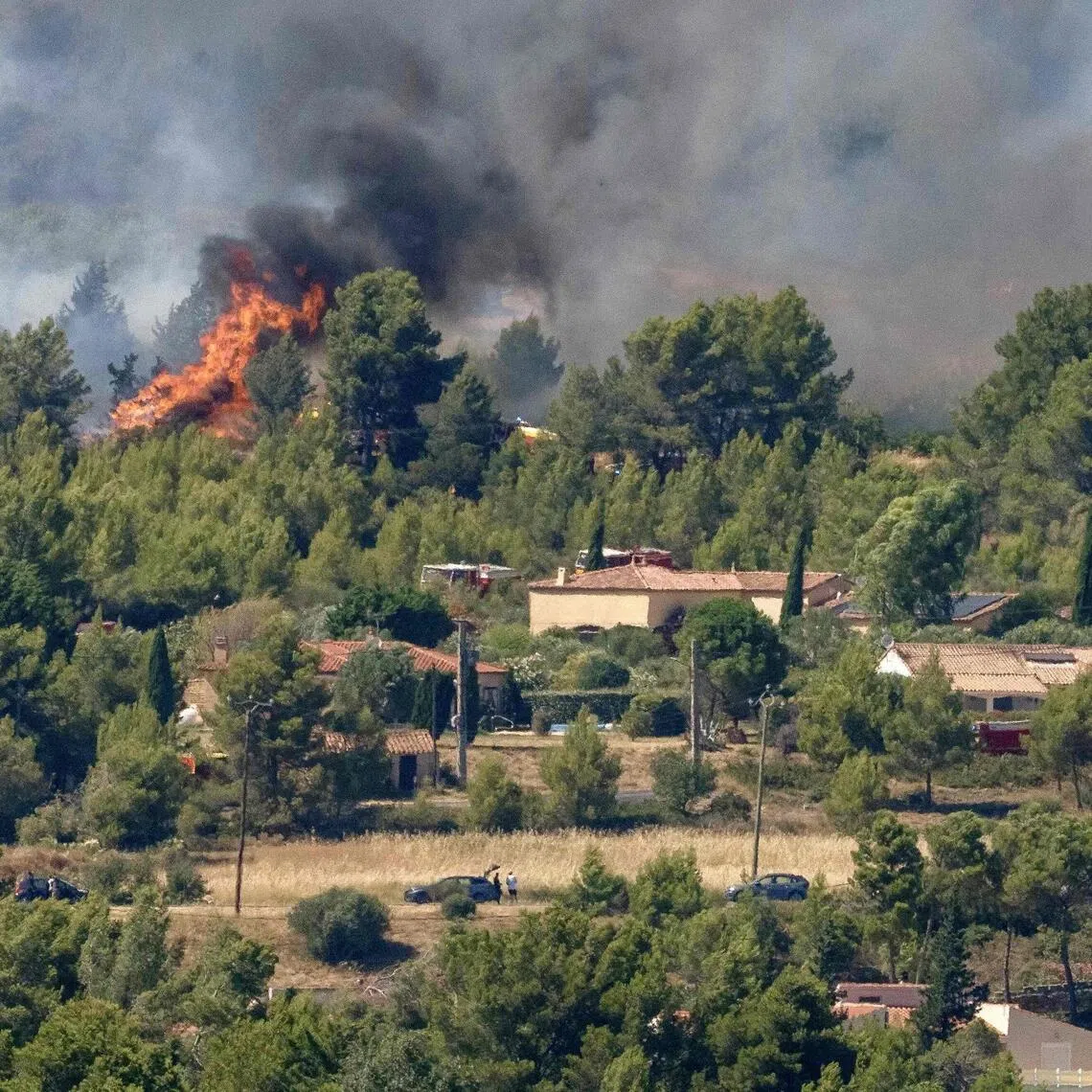 A wildfire raging near houses in Pouzols-Minervois, south-west France, on July 2.