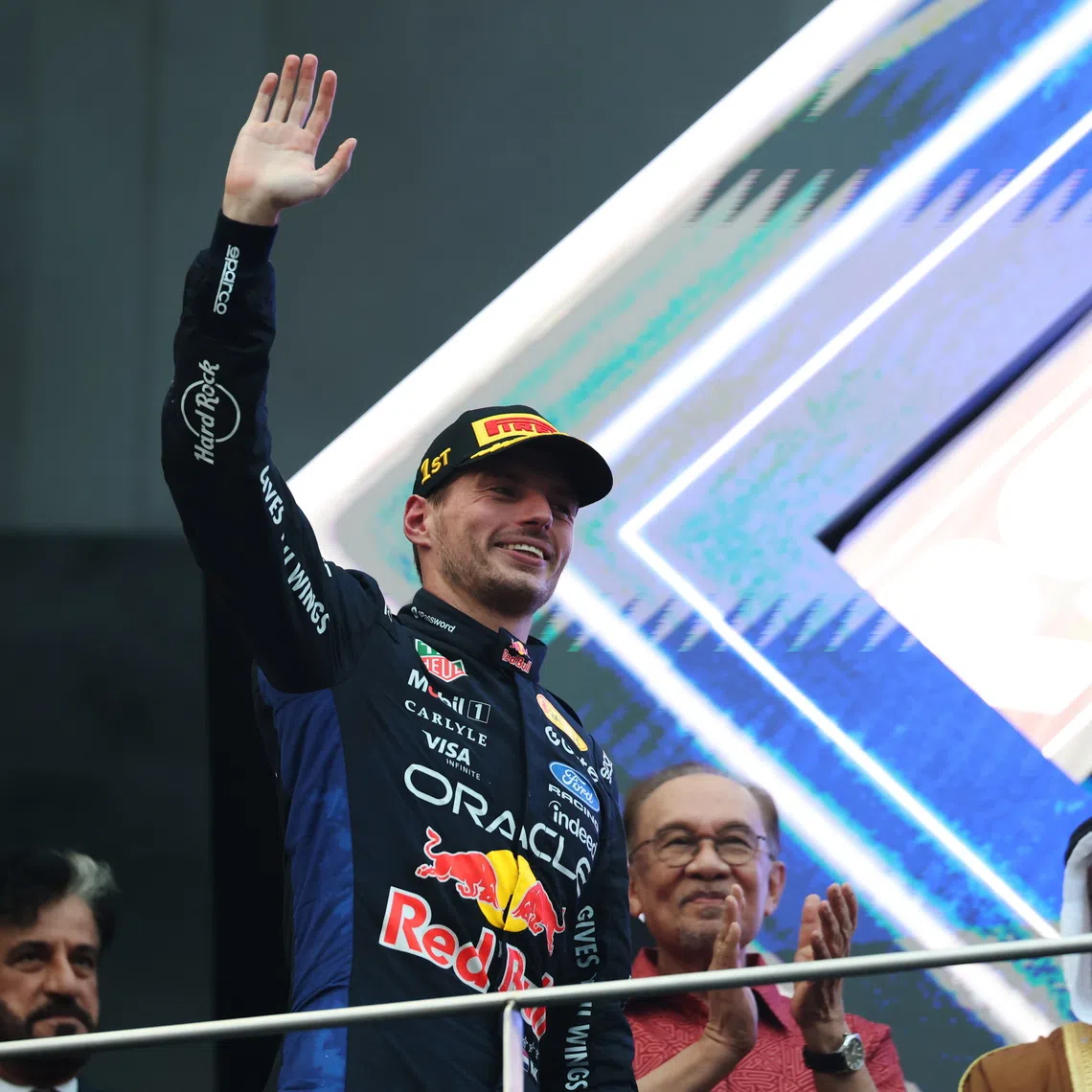 Malaysia’s Prime Minister Anwar Ibrahim (back row, centre) on the podium behind 2026 Formula 1 Bahrain Grand Prix winner Max Verstappen at the Sepang International Circuit on Oct 4.