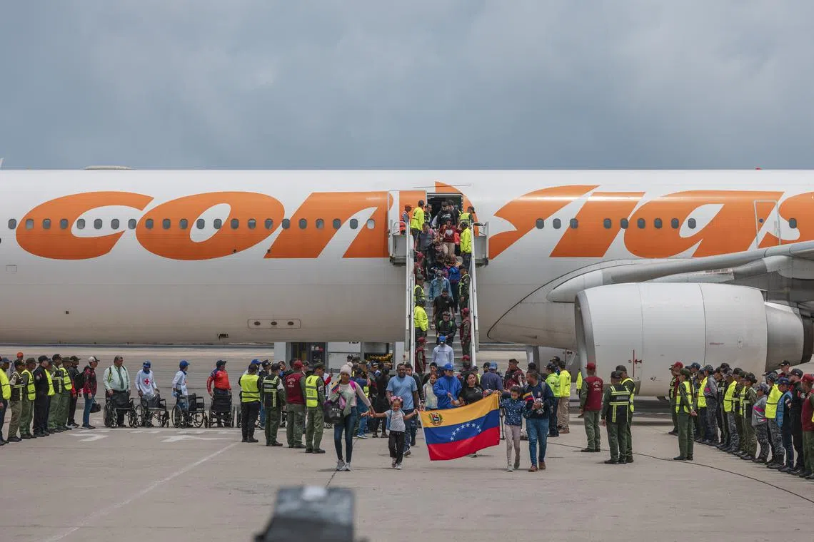 Venezuelan migrants arrive on a flight from Mexico in Maiquetia, Venezuela, on March 20.