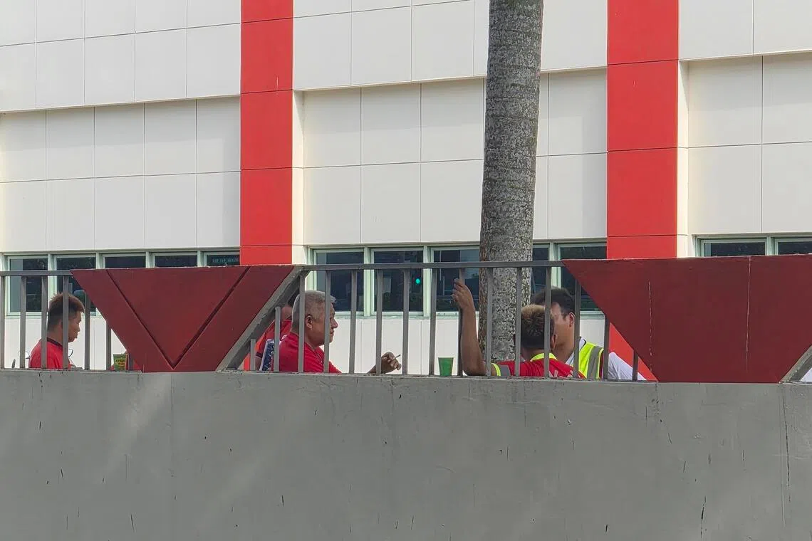 Several employees gathered near the side gate of the building along Admiralty Road West said they had not been laid off and did not know about the exercise.