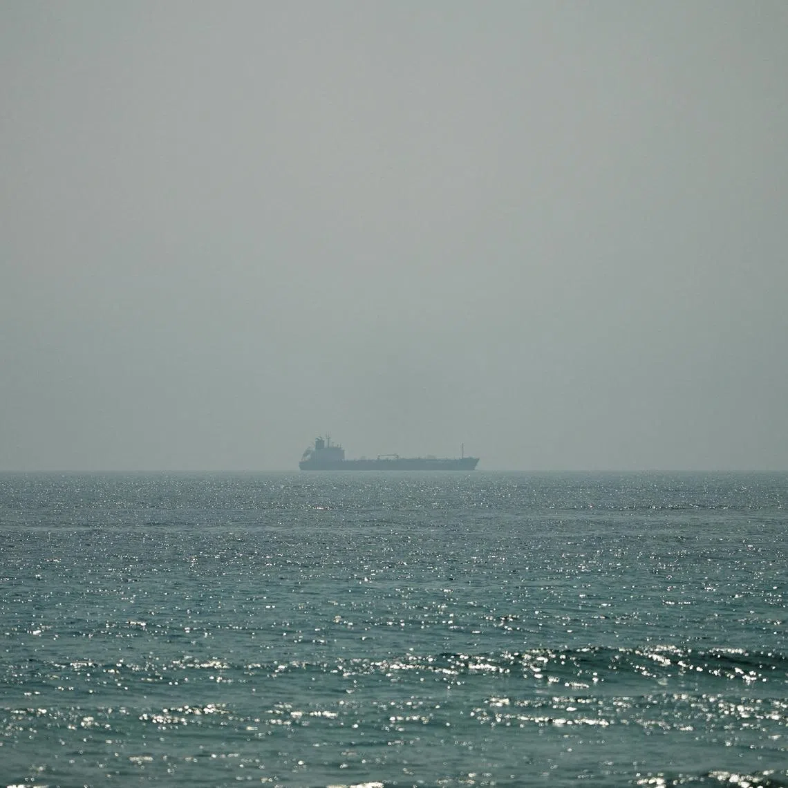 The oil tanker Al Shaffiah sailing near the Omani coast, as seen from Musandam, Oman, on June 26.