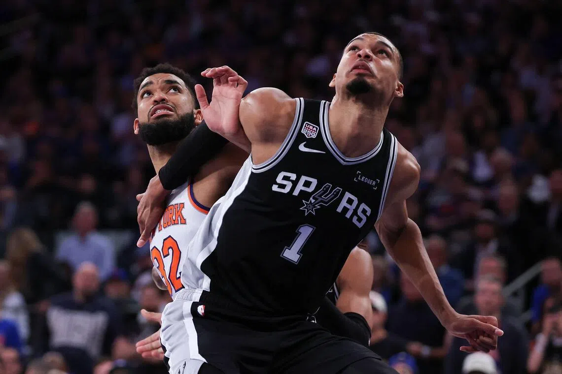 Victor Wembanyama of the San Antonio Spurs (right) and Karl-Anthony Towns battle for position during the Spurs' 115-111 win over the New York Knicks in Game 3 of the NBA Finals at Madison Square Garden on June 8, 2026 in New York City.