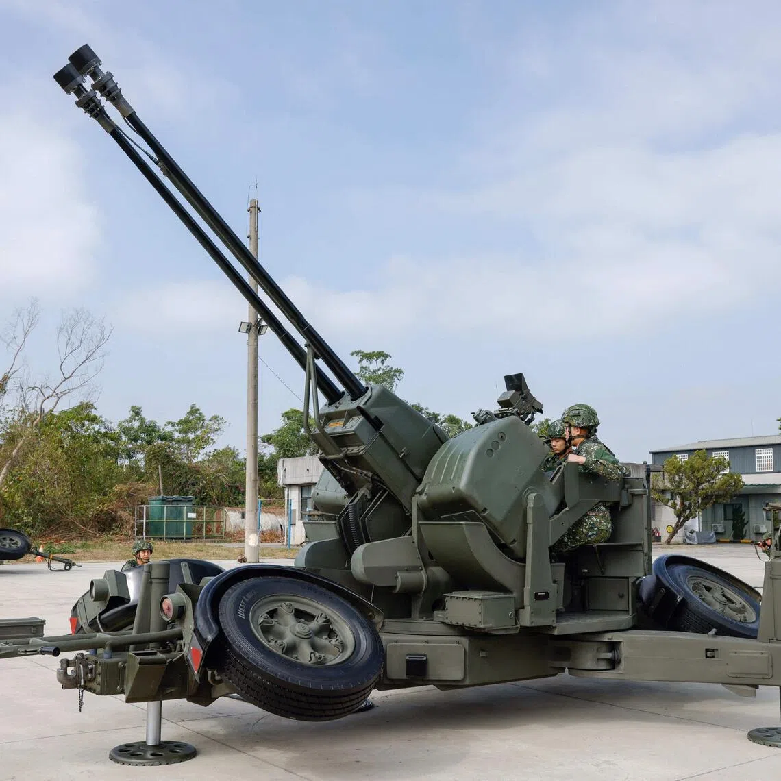 Taiwan military personnel operate an Oerlikon 35mm twin cannon at an annual military exercise.
