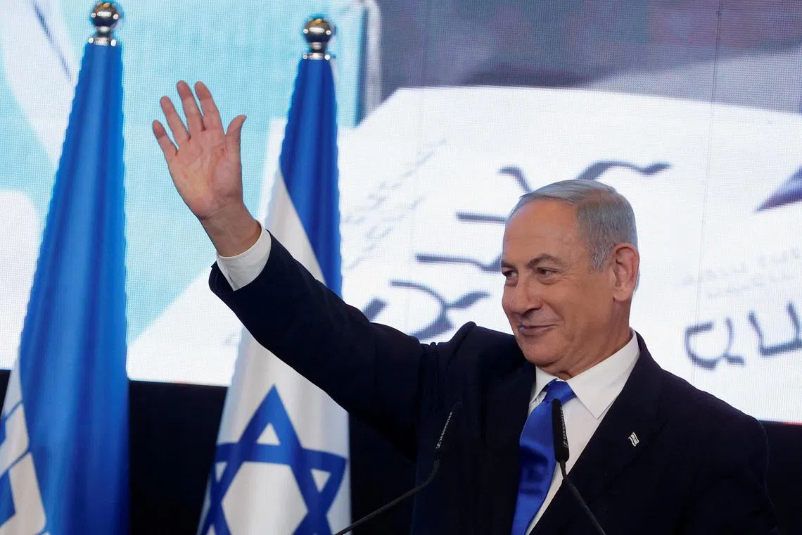 FILE PHOTO: Likud party leader Benjamin Netanyahu waves as he addresses his supporters at his party headquarters during Israel's general election in Jerusalem, November 2, 2022. 